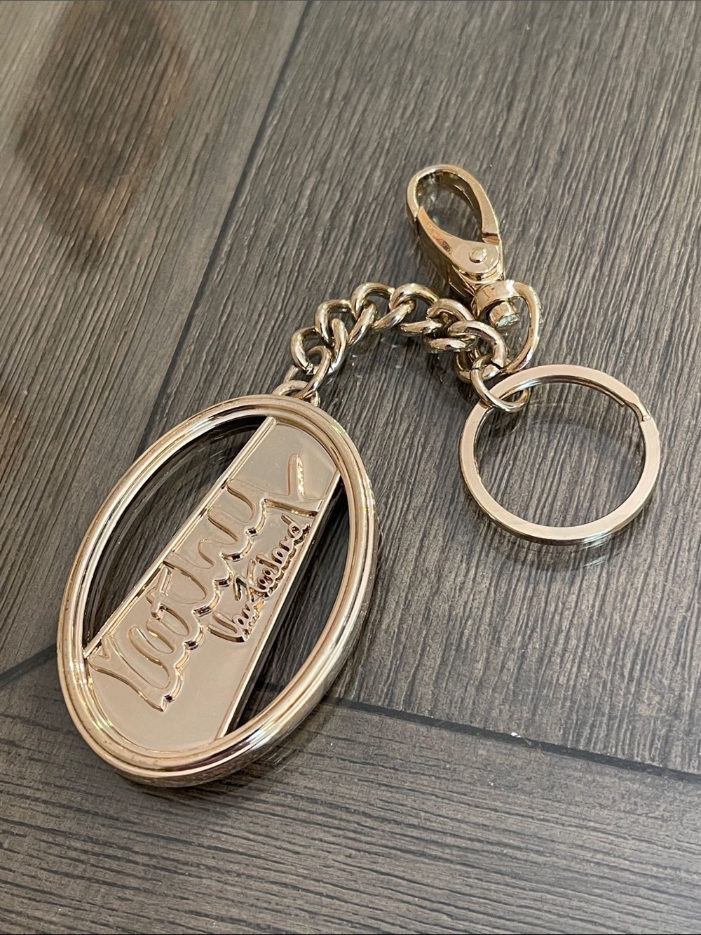 Vintage Y2K Kathy Van Zeeland Oval Logo Bag Charm - Keychain - Pale Gold-tone